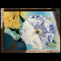A square painting of a large white flower with blue shading, green leaves, and a yellow background, photographed against a neutral fabric backdrop.